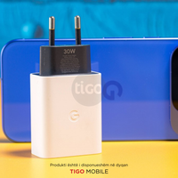 Tigo charging adapter with a blue phone in the background
