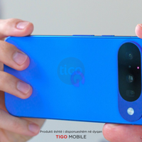 Blue phone held by hands with Tigo branding visible